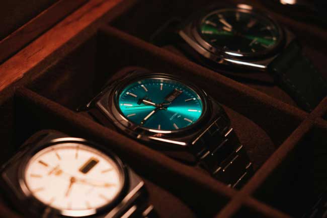 a collection of watches in a box