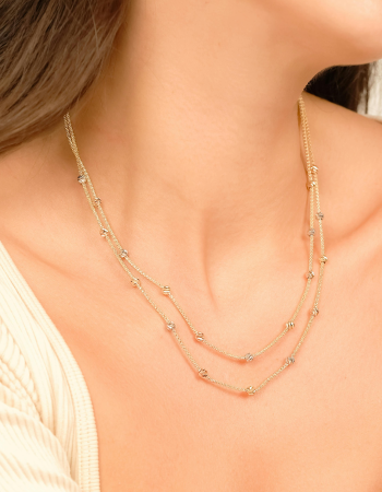 a woman wearing a necklace