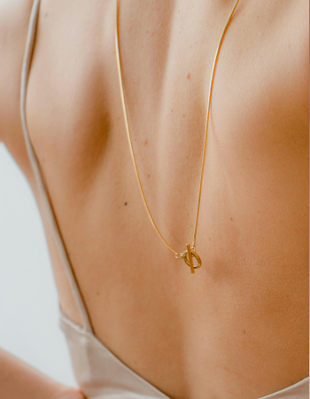 a woman wearing a necklace