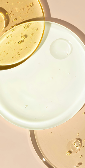 a flat lay of a yellow and clear serum with bubbles