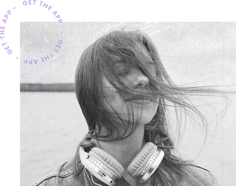 a woman with headphones around her neck