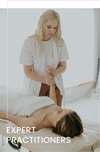 a woman massaging a woman's hand