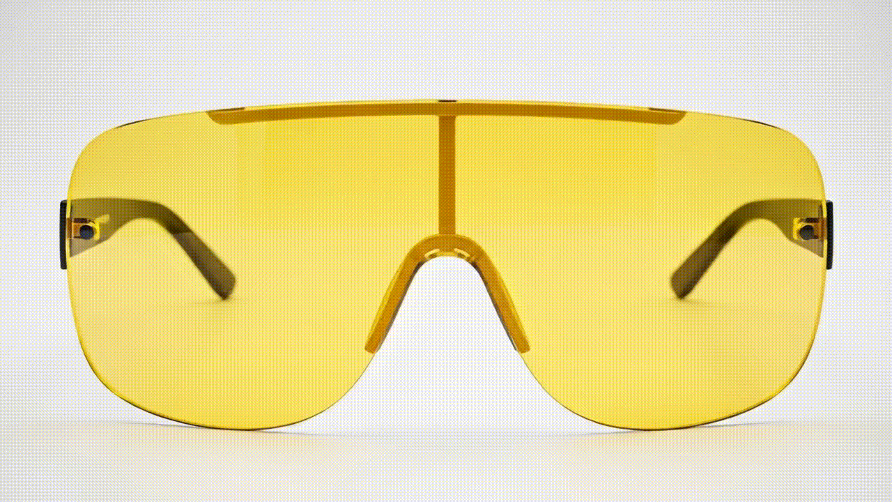 a close up of a pair of yellow sunglasses