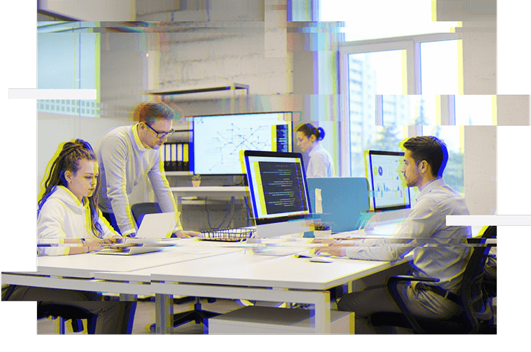 a group of people working on computers