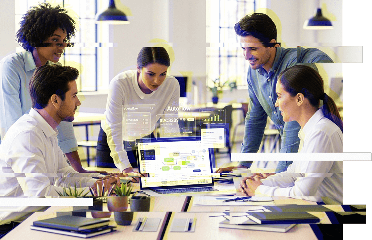 a group of people around a table looking at a laptop