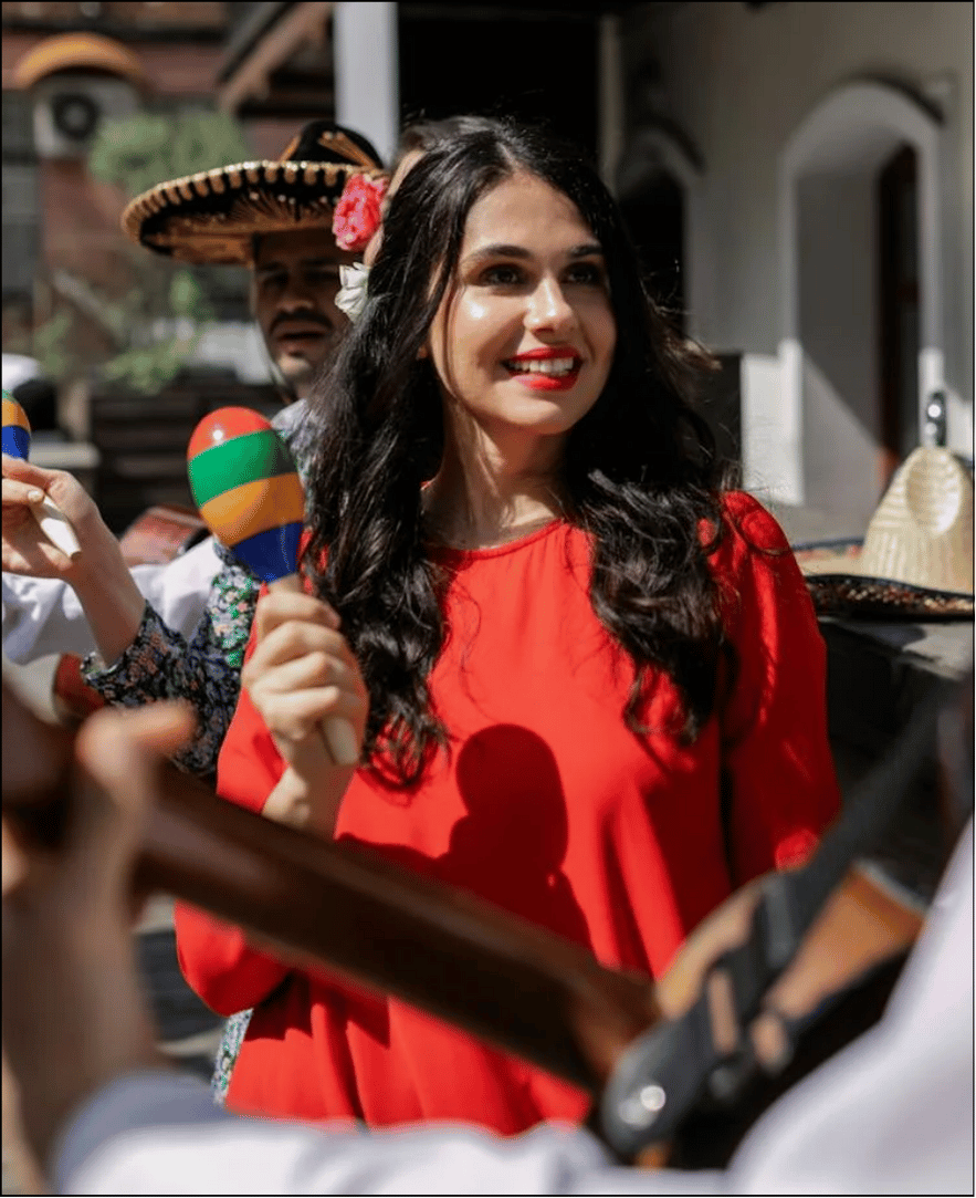 a woman with a red headband and necklace
