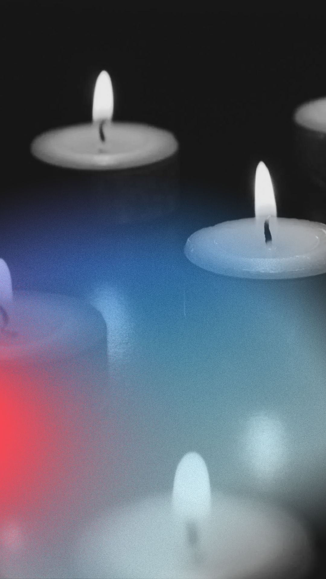 a group of candles with a flame