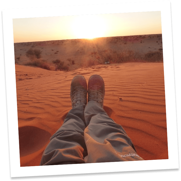 a person's legs in the sand