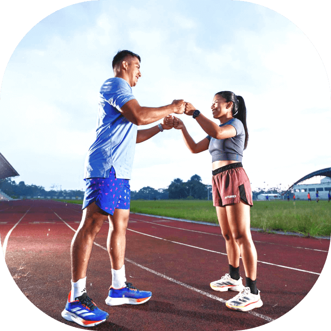 a man and woman on a track
