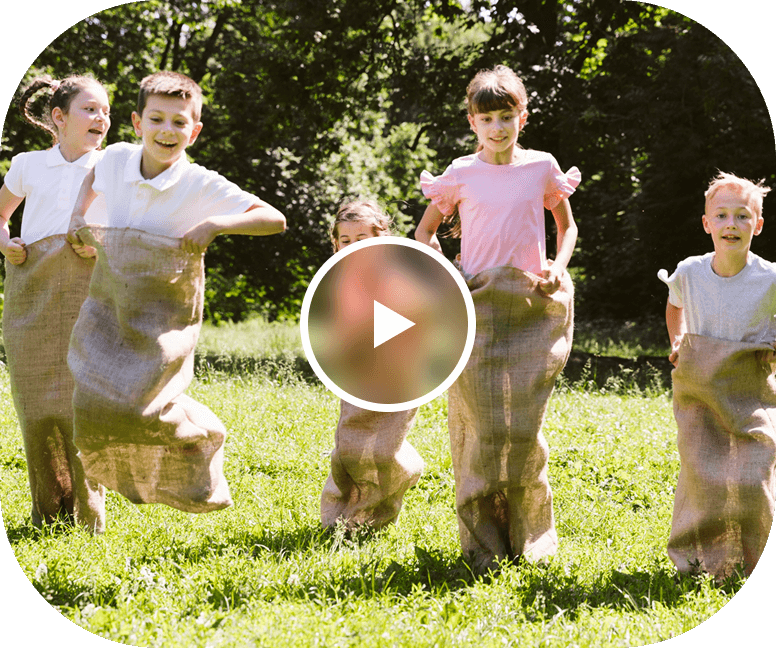 a group of children in sacks