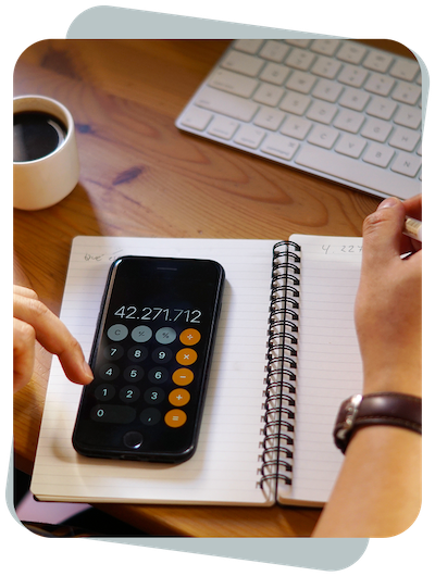 a person using a calculator on a notebook