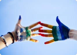 a pair of hands with paint on them