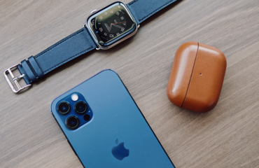 a blue smart watch next to a blue watch