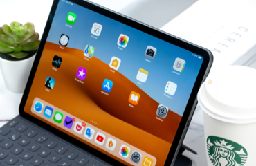 a laptop with a cup of coffee