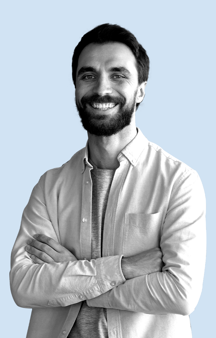 a man with a beard smiling