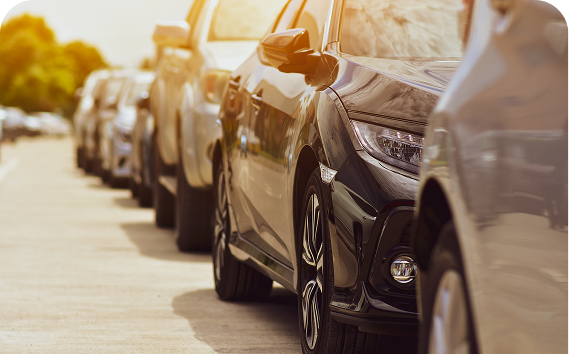a row of cars parked on a road