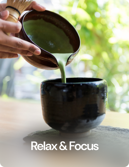 a person pouring matcha a black cup