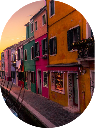 a colorful buildings along a canal