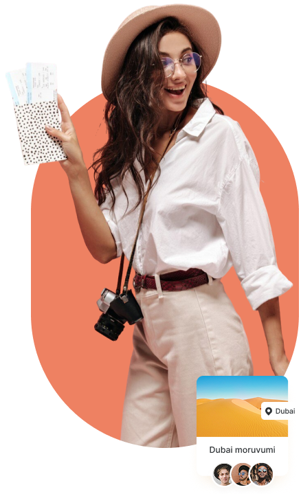 a woman holding a book and a camera