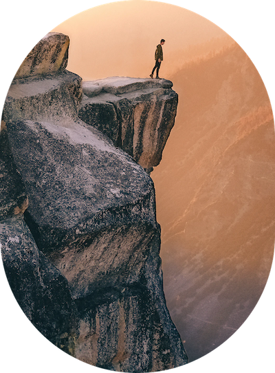 a person standing on a cliff edge