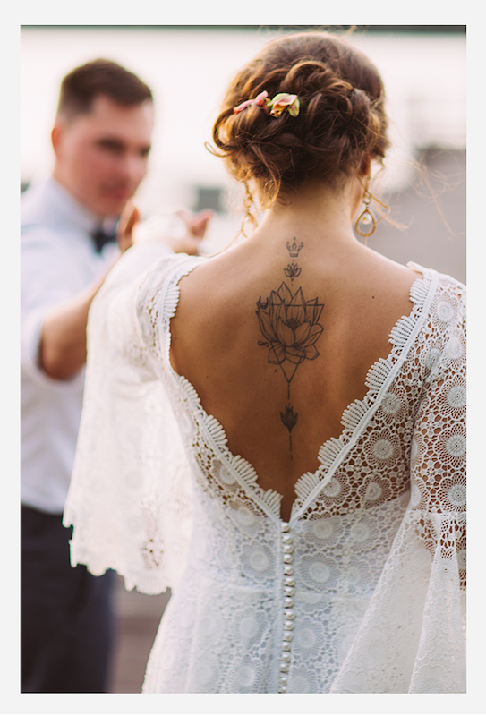 Bride with back tattoo