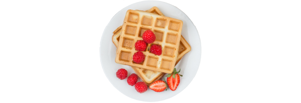 A plate with two waffles and berries.