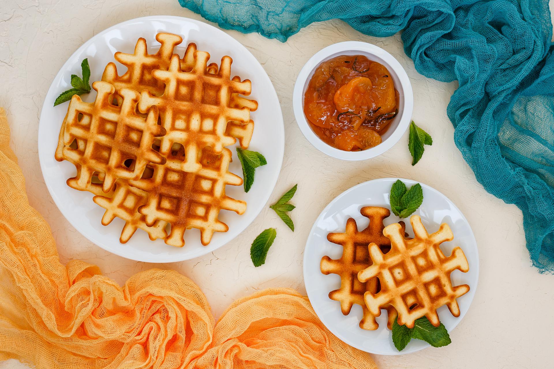 Top view of waffles and apricot jam