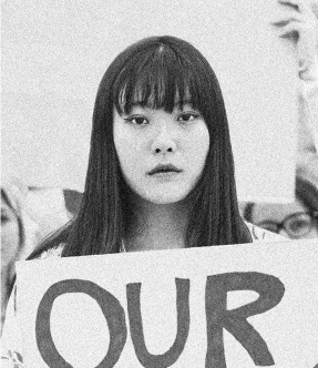 Photo Of Asian Woman Holding A Sign