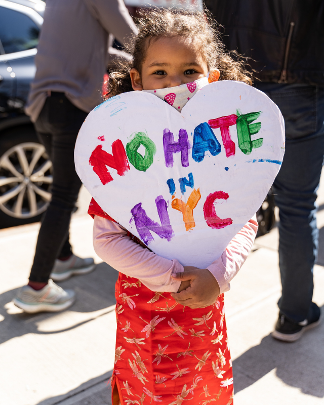 Child with no hate in NYC sign