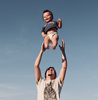 father play with his toddler