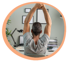 Man Stretching At Desk