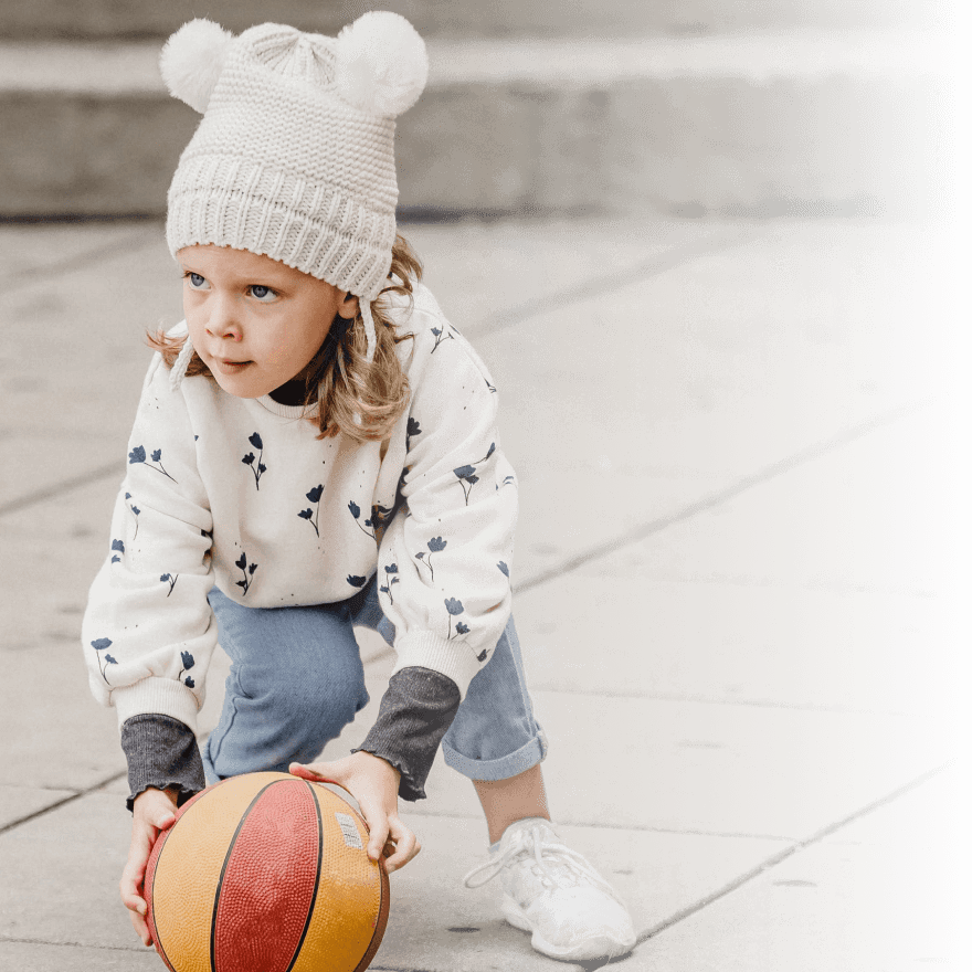 Girl holds ball