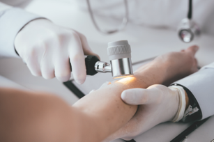 Image of dermatologist checking skin
