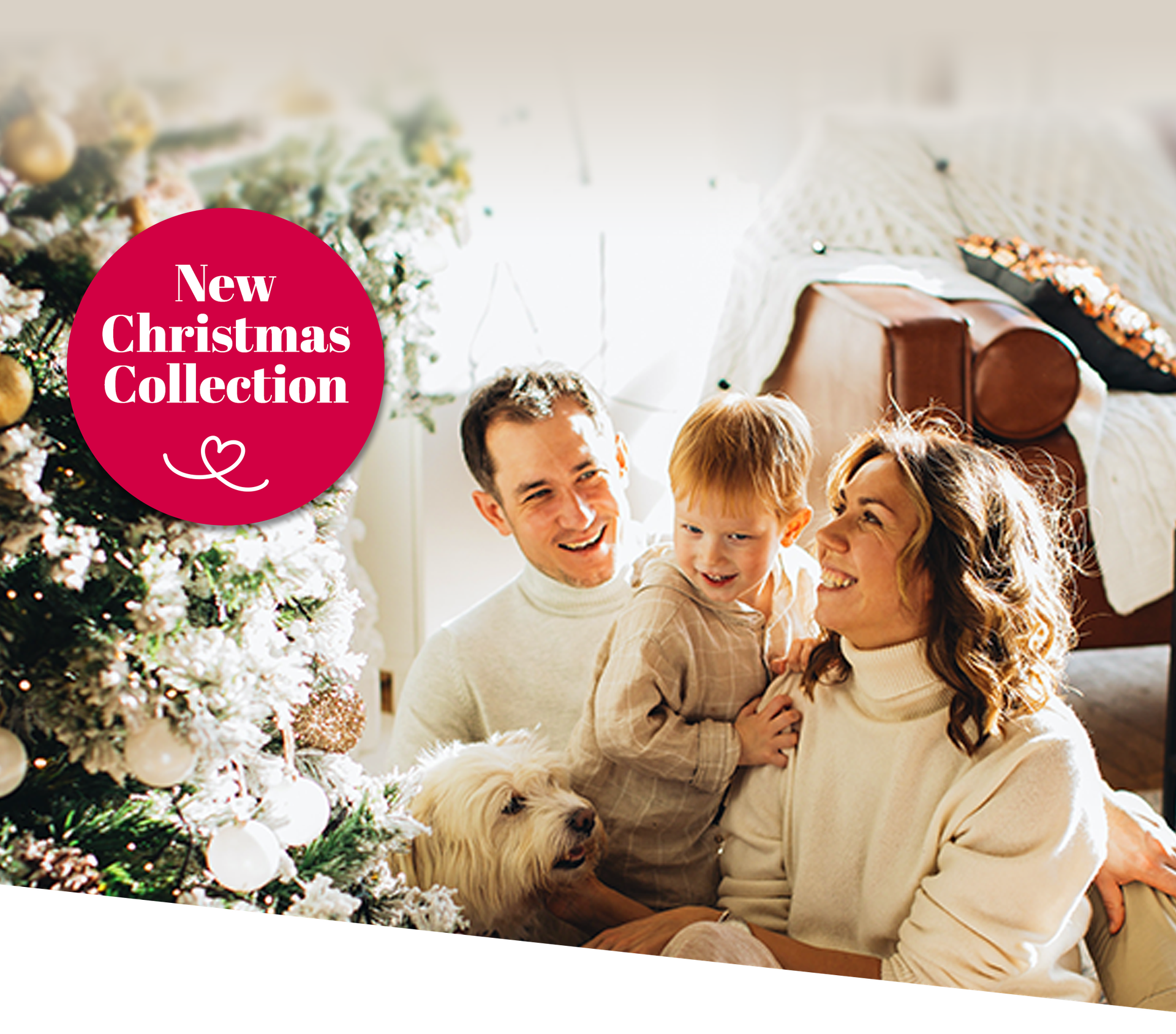 Happy family seating nest to Christmas tree