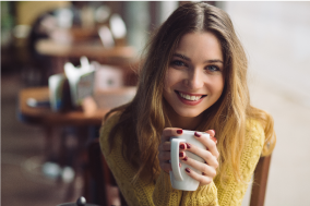 Woman Holding Mug Photo