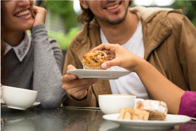 Woman Taking A Muffin Photo