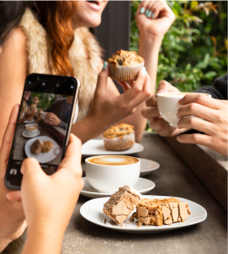 Person Taking A Phot Of Bakes In Cafe Photo