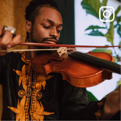 Social media image of a black male with a violin