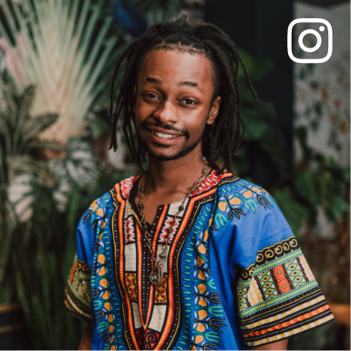 Social media image of a black male wearing a colorful traditional shirt