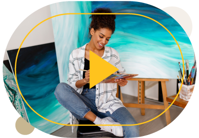 Woman Sitting In Front Of Pantings Video Thumbnail