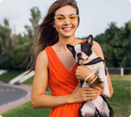 orange_dress_girl_holds_dog