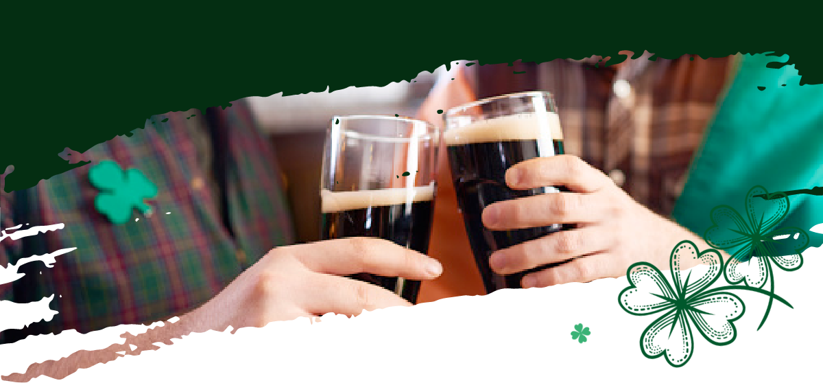 Two people holding pints of dark beer cheering