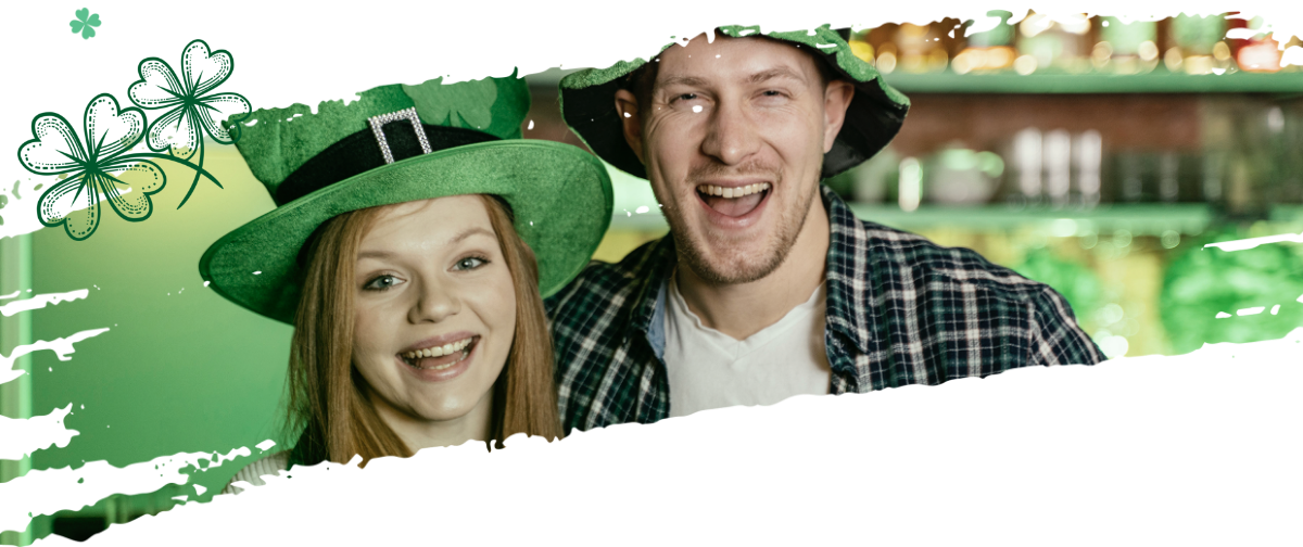 Boy and girl with green Saint Patrick hats smiling
