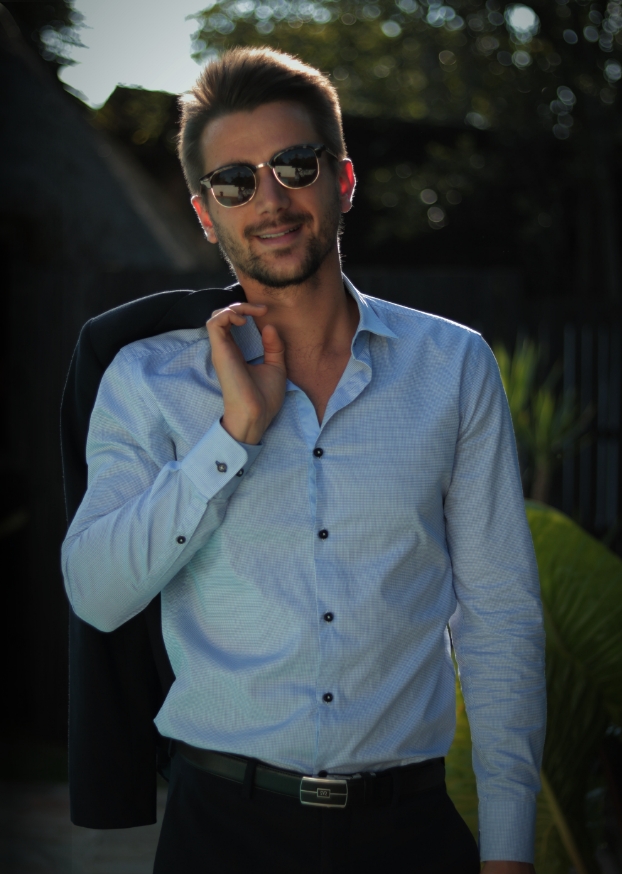 young man in formal clothing with sun glasses
