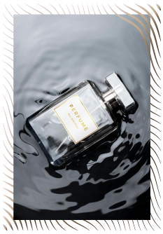 Perfume Bottle Laying In Water Photo
