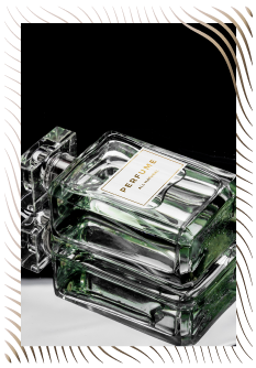 Gree Perfume Laying On Mirror Photo