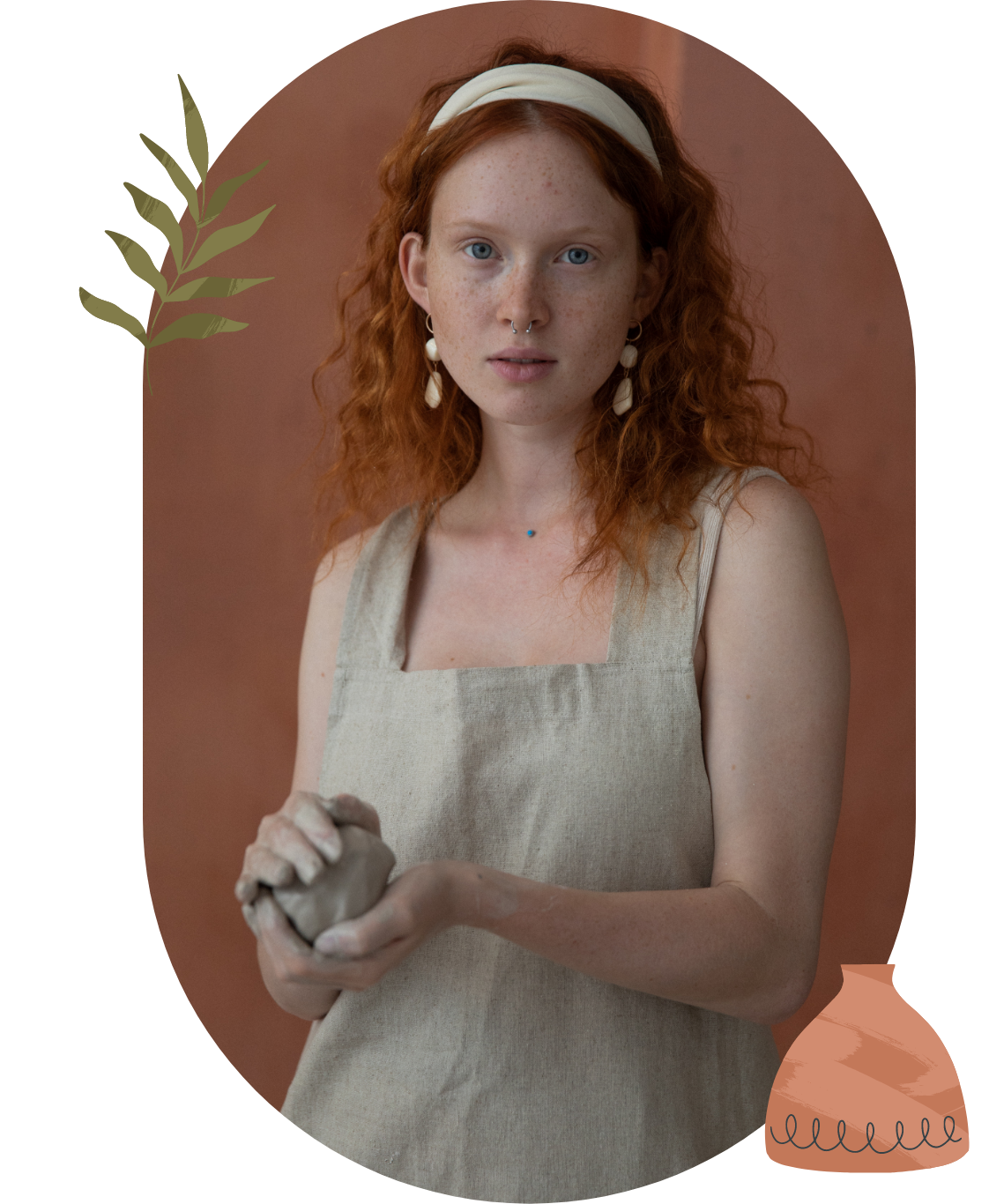 Red haired girl holding a clay ball