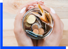 Woman Holding Money In Jar Photo