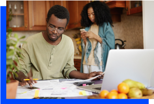 Man and Woman Calculating Bills Photo