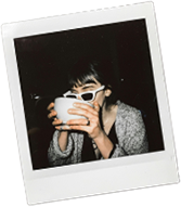 a woman holding a white bowl